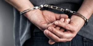 Hands in handcuffs image