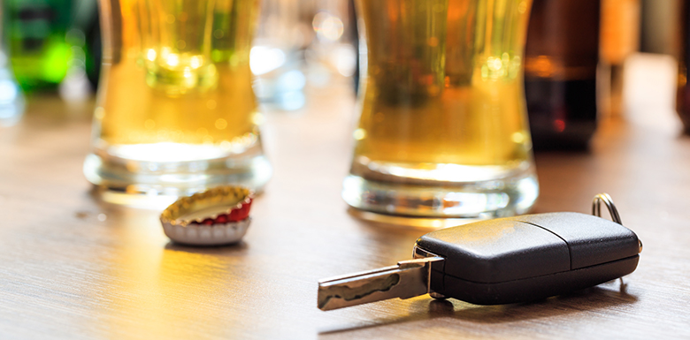 Beer glasses next to car key