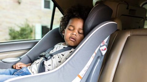Child sleeping in the back of a car