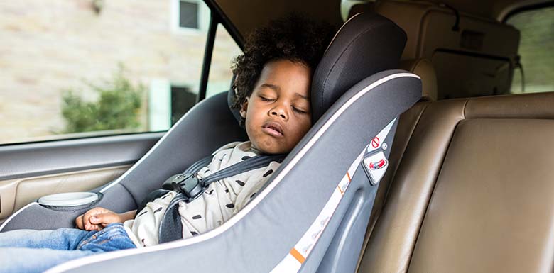 Child sleeping in the back of a car