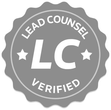Gray circular badge with scalloped edges featuring the text Lead Counsel Rated and the initials LC in the center, flanked by two stars.